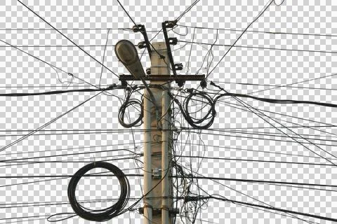 A concrete utility pole is covered in a tangled mess of electrical wires an.. Stockfoto's