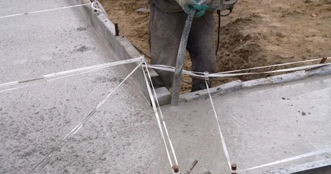 Concrete vibration generator during concreting, 4K Stock Footage 110243547