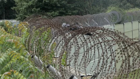 Concrete Wall With Barbed Wire Fence Near Berlin Tegel Airport TXL Close Up Stock Footage 337272220