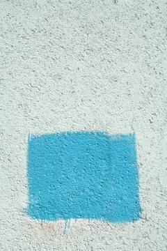 Concrete wall with blue rectangle Foto stock