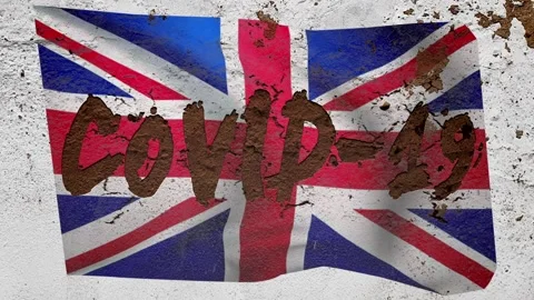 On the concrete wall with the BRITISH flag appears the inscription: "COVID-19 Video stock 128181416