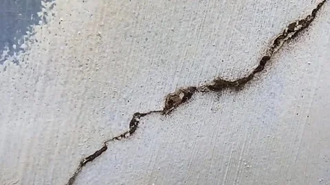 Concrete Wall Cracked Diagonal Slow Pan 5s Stock Footage 341996919