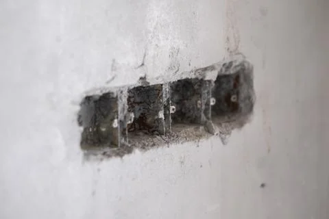 Concrete Wall with Electrical Socket Holes Stock Photos
