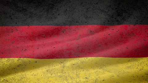 On the concrete wall with the German flag appears the inscription: "COVID-19 Video stock 128199364