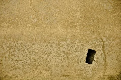 Concrete wall with one hole Stock Photos