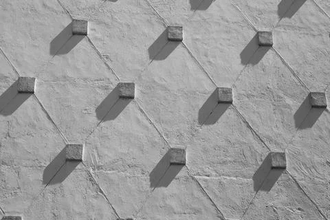 Concrete wall with a relief geometric pattern. Abstract geometric background  Foto stock