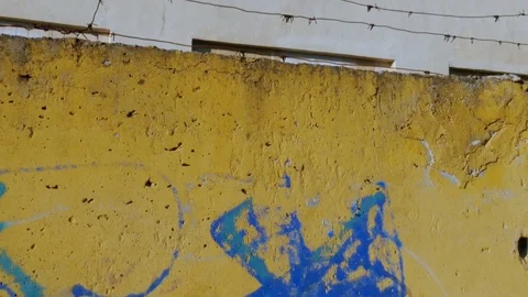 Concrete wall surrounds the old building Video stock 81337803