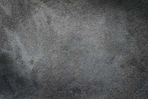 Concrete wall texture as a background, blank for a design with dark edges and Stock Photos