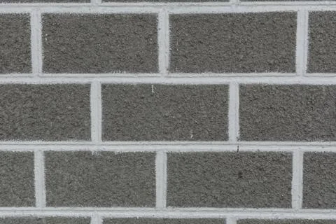 Concrete wall texture background with brick pattern Stock Photos