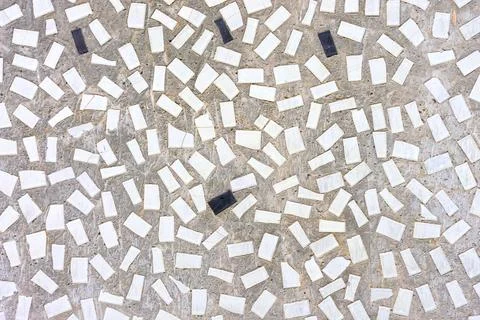 Concrete wall texture interspersed with ceramic tiles Stock Photos