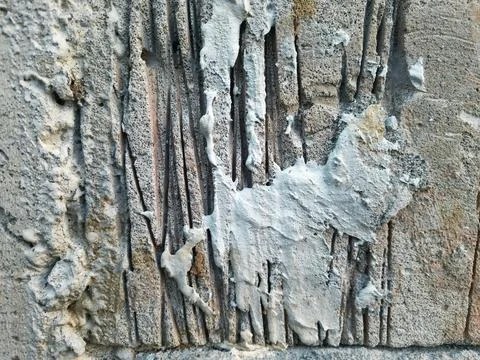Concrete wall texture with rough cement plaster and vertical grooves Stock Photos