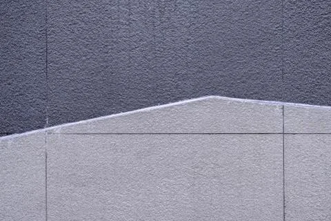 Concrete wall texture two tones design, gray and cream colors. Stock Photos
