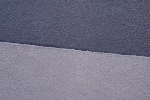Concrete wall texture two tones design, gray and cream colors. Stock Photos