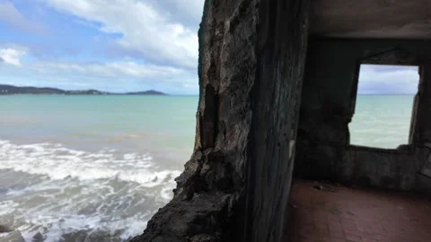 Concrete Wall with Two Islands in the Background Stock Footage 273734116