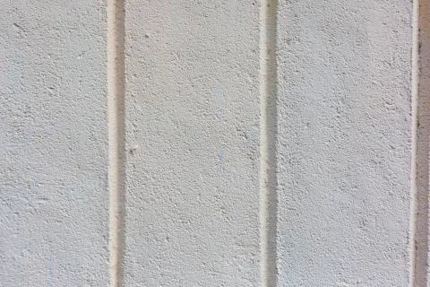 Concrete wall vertical stripes pattern texture background Stock Photos