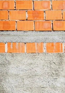 Concrete wall waiting for a layer of facade. Stock Photos