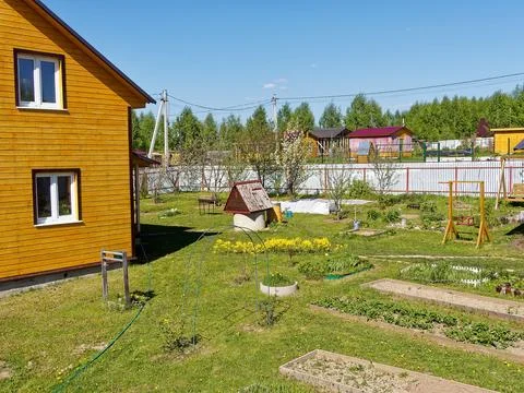 Concrete well on a rural plot Stock Photos