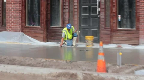 Concrete Worker Using Handfloat on City Sidewalk Pour Stock Footage 40538503