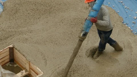 Concrete workers, construction workers pouring liquid concrete Stock Footage 253121352