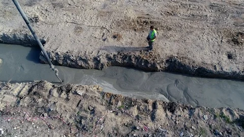 Concreting foundations at the construction site, slow motion, aerial view Stock Footage 123701484