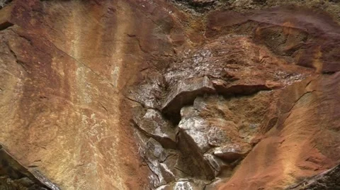 Concretion rock formations in side of stone cliff zoom out Stock Footage 65100140