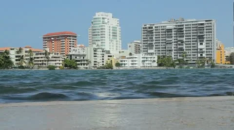 Condado Lagoon skyline - water over dike high tide waterfront flooding Stock Footage