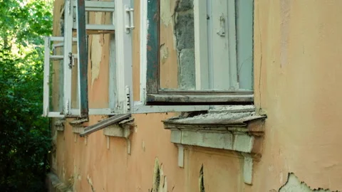 Condemned building. An empty old multi-storey house to be demolished. 4K 動画素材 106724561