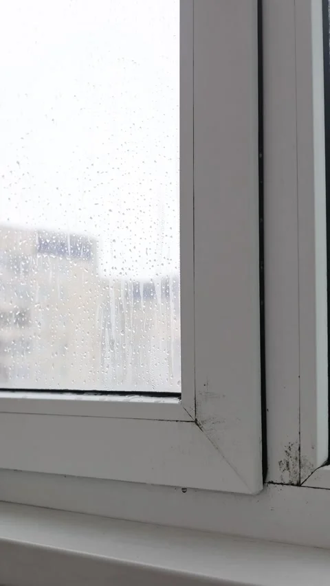 Condensation and Water Drops on Window Glass Inside Apartment During Cold Season Stock Footage 327532987