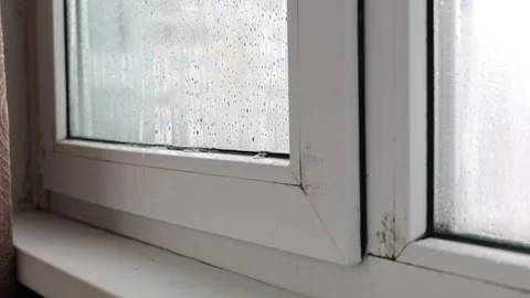 Condensation and Water Drops on Window Glass Inside Apartment During Cold Season Stock Footage 327532991