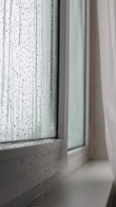 Condensation and Water Drops on Window Glass Inside Apartment During Cold Season Stock Footage 327532993