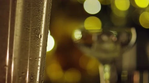 Condensation drips down ice bucket focus shift cocktail glass falling ice cubes Stock Footage 47676246