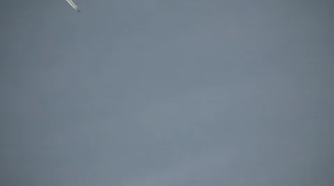 Condensation trails left behind from a passing airplane (High Definition) Stock-Footage 68978