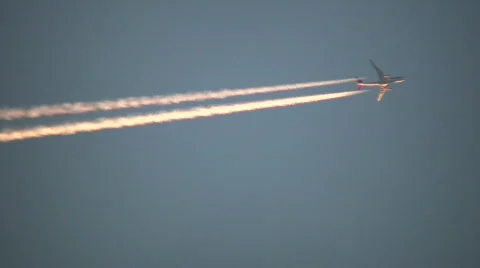 Condensation trails left behind from a passing airplane (High Definition) Stock Footage 366523