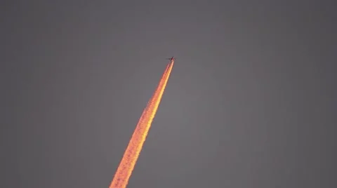 Condensation trails left behind planes passing through the morning sky Stock Footage 60780454