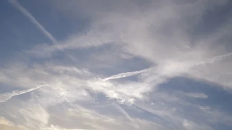 Condensation trails left in the sky by high flying crafts. Video stock 79453976