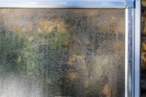 Condensation on Transparent Panel with Metallic Frame Stock Photos
