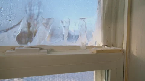 Condensed ice bubbles on old windows at home. Close up footage of window element Stock Footage 267724243