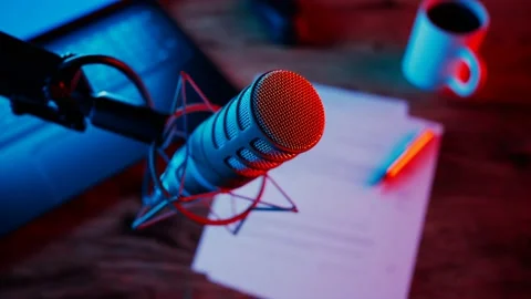 Condenser microphone in red shock mount with blue and red neon light Stockbeeldmateriaal 201161413