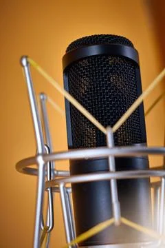 Condenser studio microphone for broadcast communication, on a table stand, cl Stock Photos