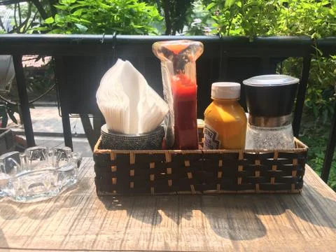 Condiments At A Cafe, Served On A Sunlit Balcony Stock Photos