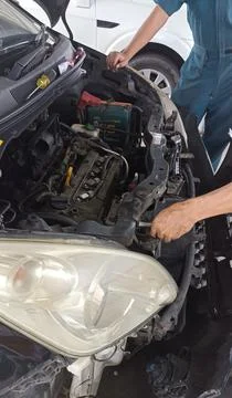 The condition of a car engine being checked by a mechanic Stock Photos