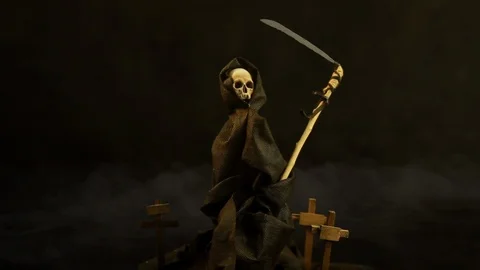 Conditional symbol of death in dark mantle with hood on dark background fog Stock Footage 121884717