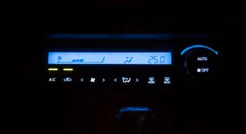 Conditioner and air flow control digital system in a car night time Stock Photos
