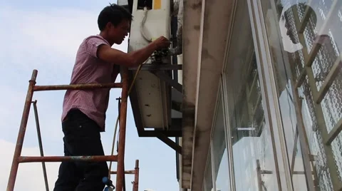 Conditioning repair workers Stock Footage 64578796