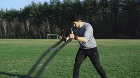 Conditioning Rope Training In Open Field, Man Stock Footage 159763855