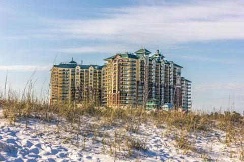 Condo Beyond Sand Dune Stock Photos