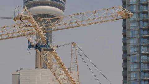 Condo Construction Development Building Tower Crane Tips CN Tower Background  Stock Footage 92319486