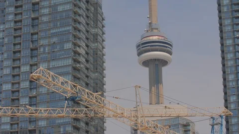 Condo Construction Development Building Tower Crane Tips CN Tower Background Video stock 92319517