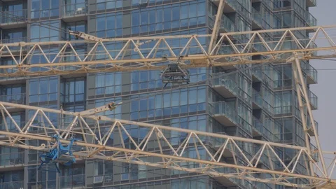 Condo Construction Development Tower Crane Building Side By Condo Background  Video stock 92186663