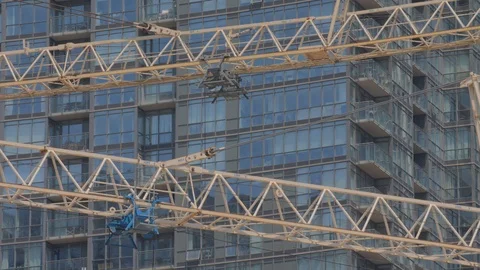 Condo Construction Development Tower Crane Building Side By Condo Background  Stock Footage 92186689